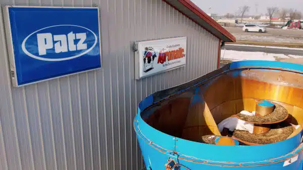 Used PATZ 950 Trailer Mixer, 2400 Series II (overhead view) next to PATZ and Agromatic signs on Schmidt Buildings building in Forest Junction, WI 54123