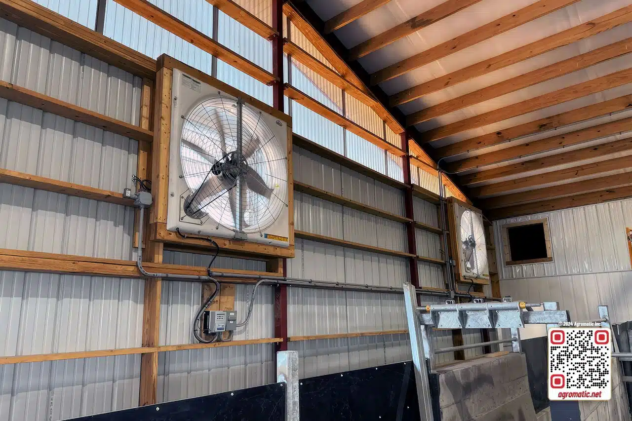 Electrical installation of positive pressure fans in cow barn (inside view).